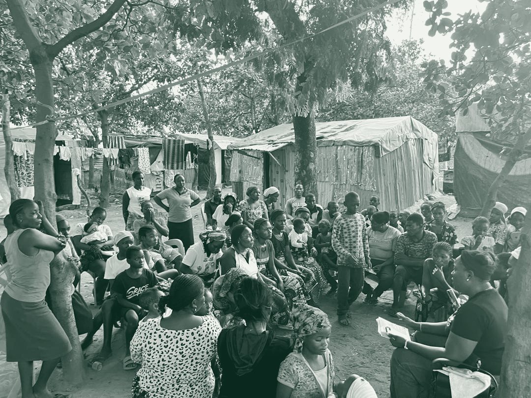 Members of the community gather during a Fisho Initiative outreach visit.