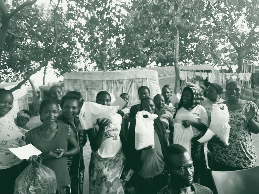 Women line up to receive food packages during a Fisho Initiative distribution.